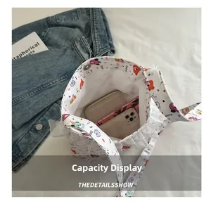 Detail view of small canvas bag capacity showing interior for phone and wallet