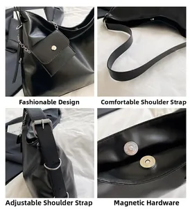 Detail der schwarzen Leder-Tote mit silbernem Magnetverschluss und verstellbarer Schnalle