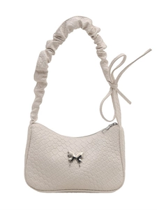 Chic pleated off-white underarm bag with silver butterfly accent and ribbon handle
