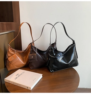 Detailed set of three retro soft leather hobo bags in caramel, brown, and black colors