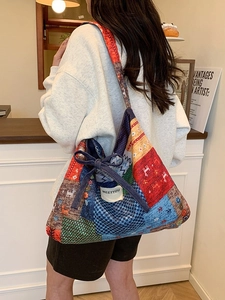 Vintage patchwork shoulder bag with colorful embroidery and a navy bow decoration