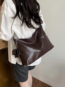 Brown leather tote bag with silver chain and mini pouch for women stylish everyday use