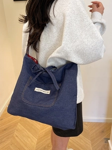 Vintage dark blue denim tote bag with butterfly ribbon and embroidery details