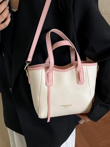 French style contrast leather bucket bag with pink trim and adjustable shoulder strap