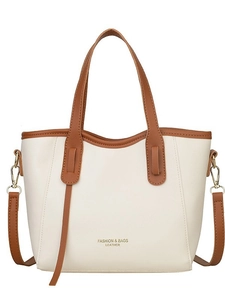 Minimalist beige tote bag with brown leather trim and golden hardware detailing