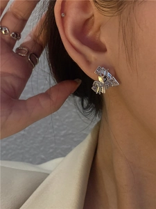 Detail of S925 silver stud earrings with rectangular zircons and HUNG STORY engraving
