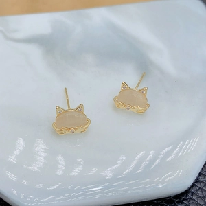 Cute cat-shaped stud earrings with gold plating and cat-eye stones in a minimalist style