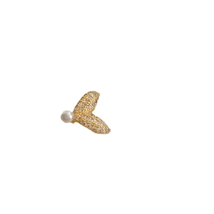 Elegant gold fish tail ear cuff with sparkling zircon accents and a white pearl on white background