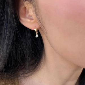 S925 silver gold heart hoop earrings with round zircon stones worn by a model