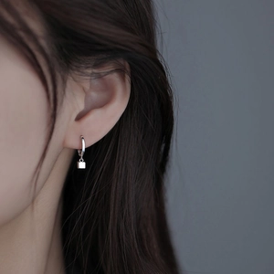 Minimalist S925 silver geometric cube hoop earrings worn on model for a modern look