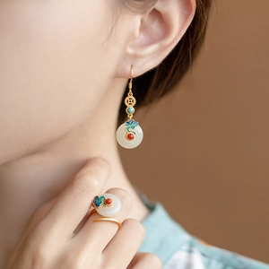 Detail of Chinese style enamel cloud earrings and ring set in matte gold finish