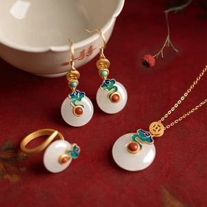 Detailed close-up of S925 vintage jewelry set with enamel clouds and white jade charms