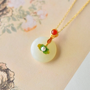 Elegant Chinese lotus jade pendant necklace with gold leaf detail and red bead accent