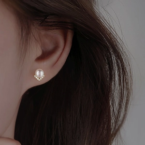 Elegant S925 silver pearl stud earrings with V-shaped gold base and sparkling zircon accents