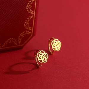 Elegant s925 gold hollow rose hoop earrings on luxury red background display
