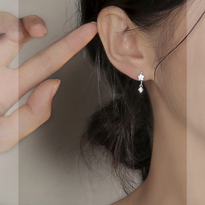 Elegant S925 silver flower hoop earrings with zircon pendant shown on model