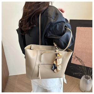 Chic beige large tote bag with zipper pocket and decorative silk scarf detail