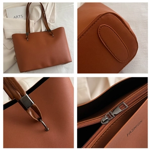 Détails du grand sac cabas marron caramel avec texture cuir et fermeture zippée