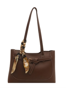 Deep brown tote bag with decorative scarf and white stitching on a clean white background