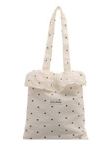 White ruffle canvas tote bag with black floral print and AGOGO logo on front view