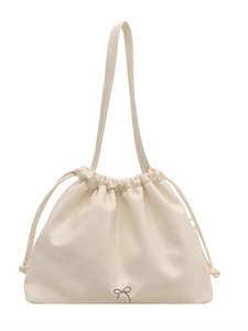Minimalist creamy white PU leather tote bag with drawstring closure and metal bow accent