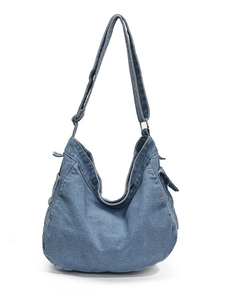 Vintage blue denim messenger bag with adjustable strap and side pockets for casual daily use