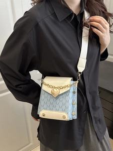 Blue denim crossbody bag with M pattern and white leather flap with wide shoulder strap