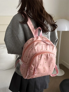 Pink mini floral backpack for girls featuring tulip embroidery and water-resistant fabric