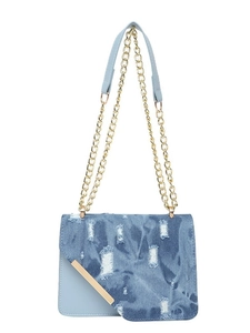 Trendy light blue denim crossbody bag with distressed detail and golden chain strap