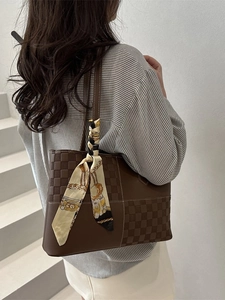 Brown leather tote bag with checkered pattern and decorative silk scarf for women
