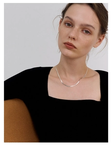 Minimalist S925 silver flat snake chain necklace shown on model with black square neck top