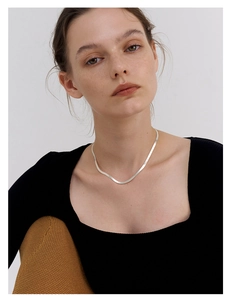 Minimalist S925 sterling silver flat snake chain necklace worn by a fashion model