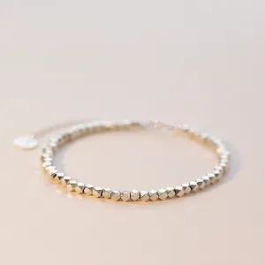 Elegant S925 sterling silver irregular nugget bead bracelet with small fortune tag charm