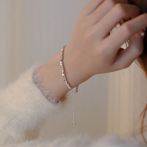 Minimalist S925 sterling silver irregular bead bracelet worn on wrist with soft sweater