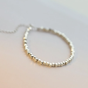 Close-up of S925 sterling silver beaded bracelet with faceted beads and extension chain