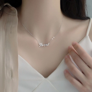 S925 silver Forever letter pendant necklace with sparkling stones on model