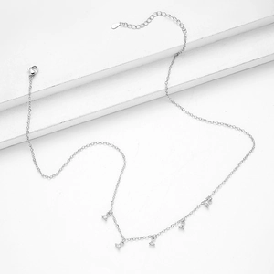 925 silver necklace with five triangular zircon clusters on a layered display stand