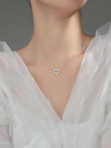 Sparkling S925 sterling silver heart necklace with pavé zircons on a delicate chain