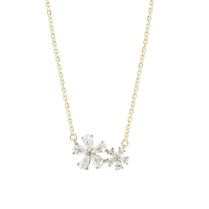 Detail shot of golden cherry blossom necklace with crystal floral pendant and sleek chain
