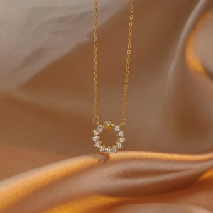 Detail of 925 silver gold star necklace with shimmering white zircon stones