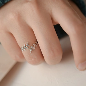 Elegant S925 sterling silver leaf ring with pavé cubic zirconia on hand model