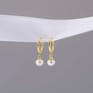 Elegant gold pearl drop hoop earrings with S925 engraving on a white ribbon