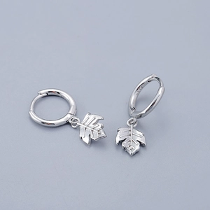 Macro shot of S925 sterling silver maple leaf earrings showing detailed texture