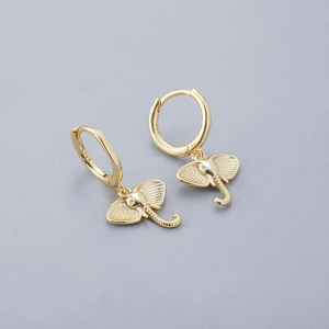 Detail of 18K gold S925 silver elephant earrings with cubic zirconia eyes and textured ears