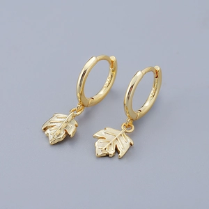 Close-up of S925 sterling silver maple leaf earrings with hallmark engraving