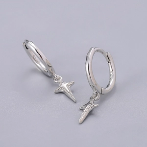 Macro view of S925 sterling silver star drop earrings with polished hoop and star charm