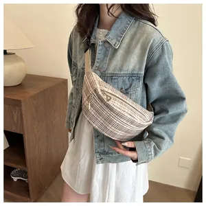 Detailed view of casual plaid canvas chest bag with adjustable strap and double zippers