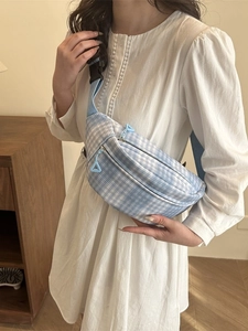 Blue and white checkered crossbody waist bag with adjustable strap and dual zippers