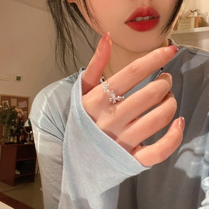 Elegant silver butterfly open ring with sparkling zircons worn on index finger
