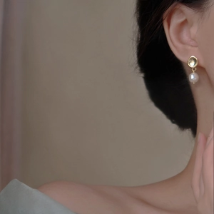 French style S925 silver pearl drop earrings with golden disc design worn by a model